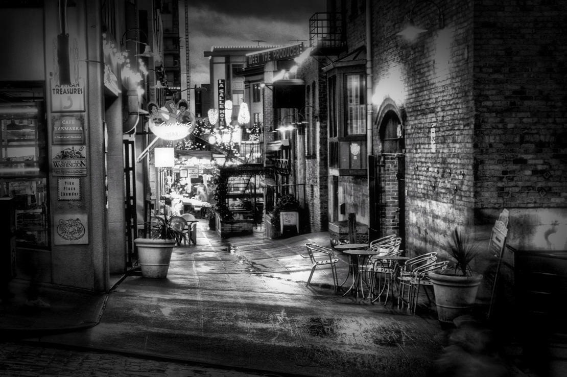 Rain-slick alley at night